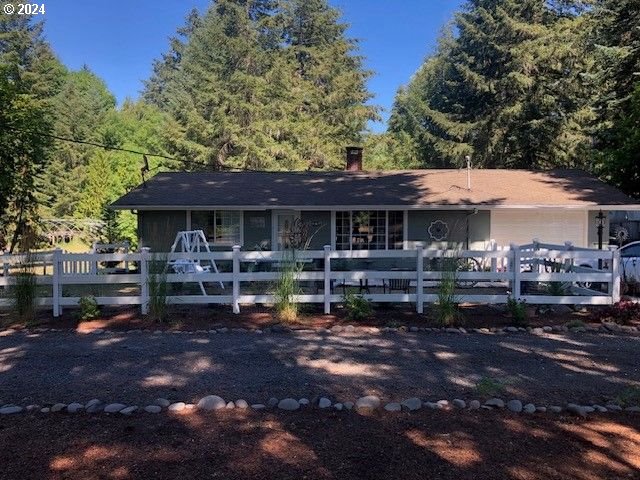 a view of a house with backyard porch and sitting area