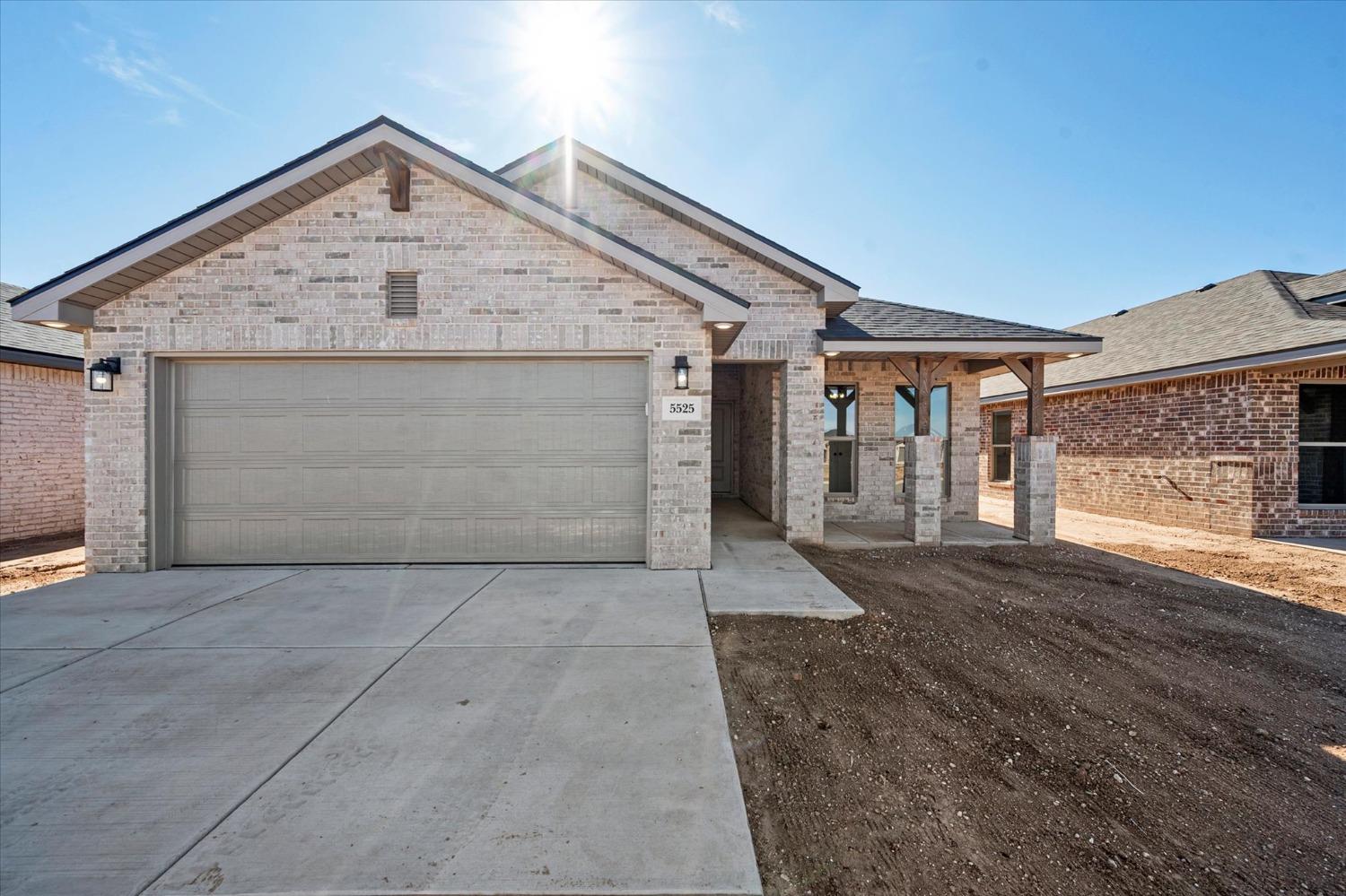 a front view of a house with garage