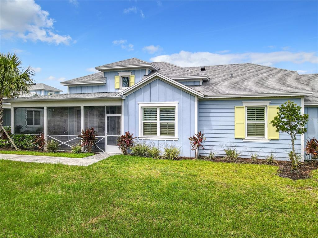 a front view of house with yard and outdoor seating