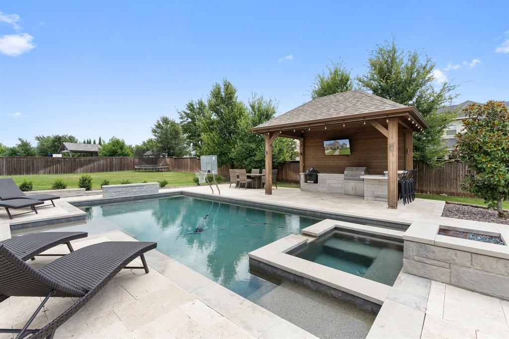 a view of a patio with swimming pool table and chairs