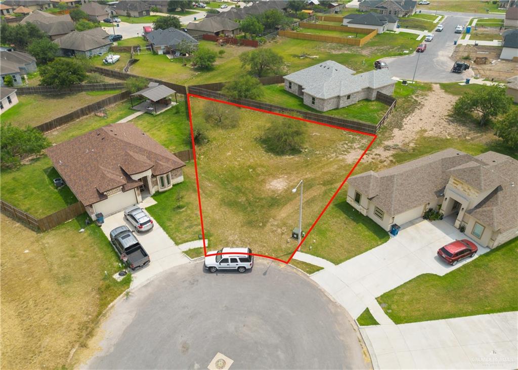 an aerial view of a house with a garden