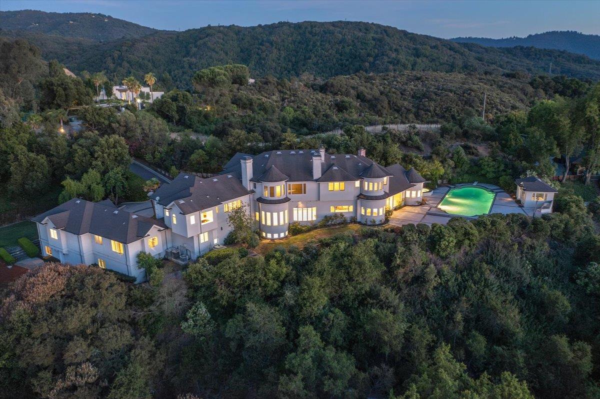 an aerial view of a house with mountain view