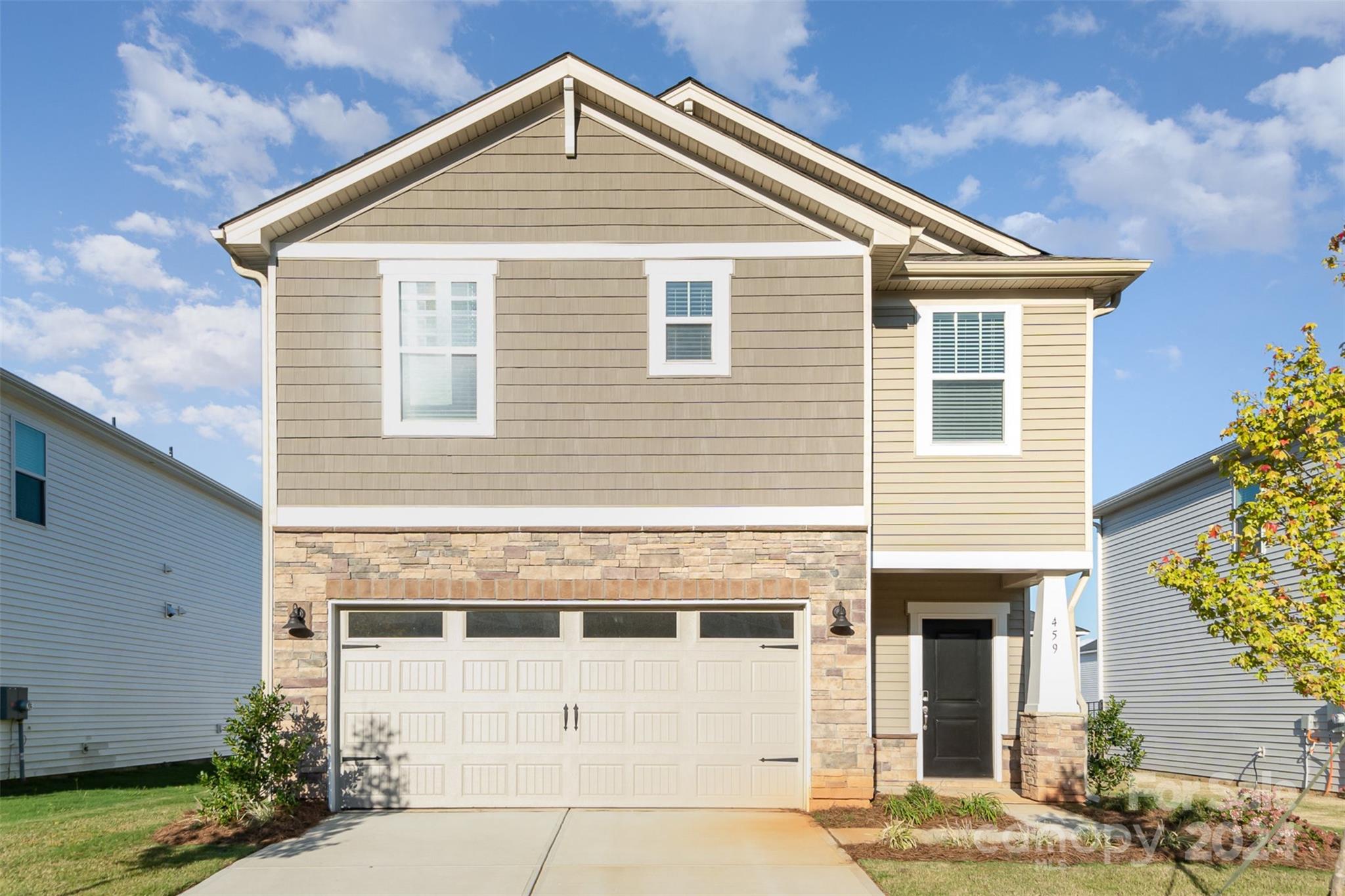 a front view of a house with a yard