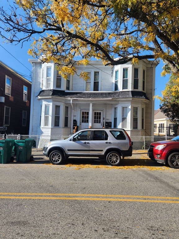 a car parked in front of a house