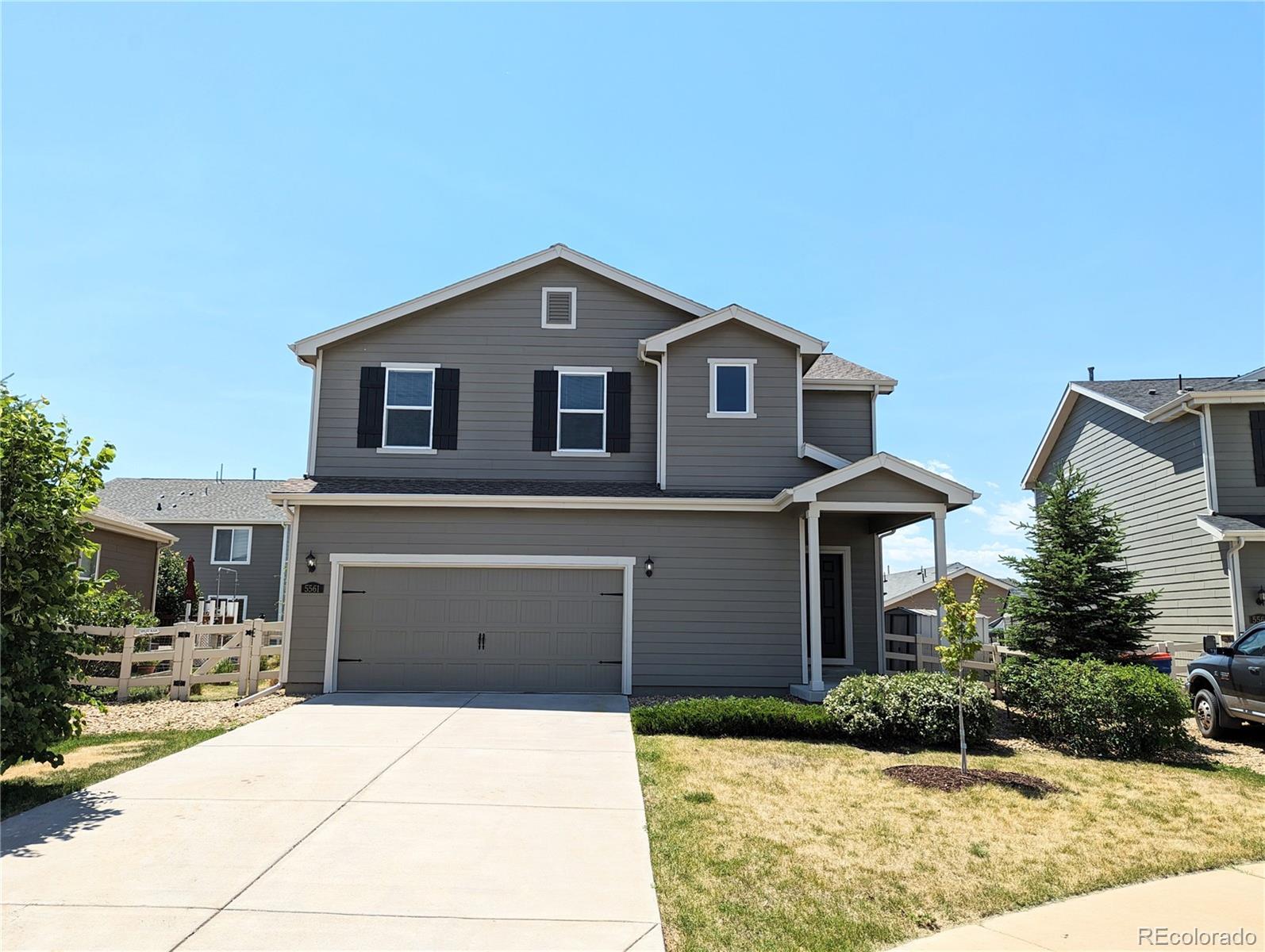 a front view of a house with yard