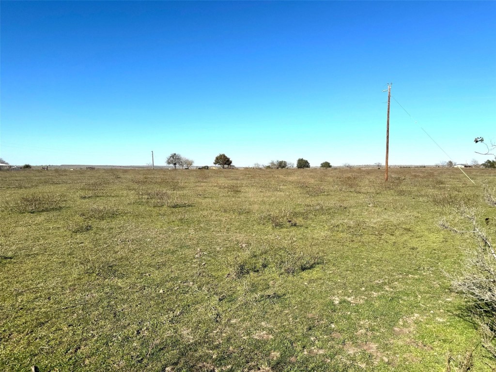 a view of a large building with a field