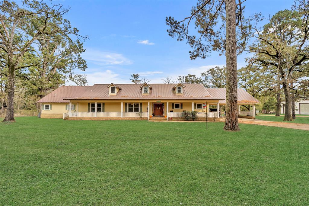 a view of a house with a big yard