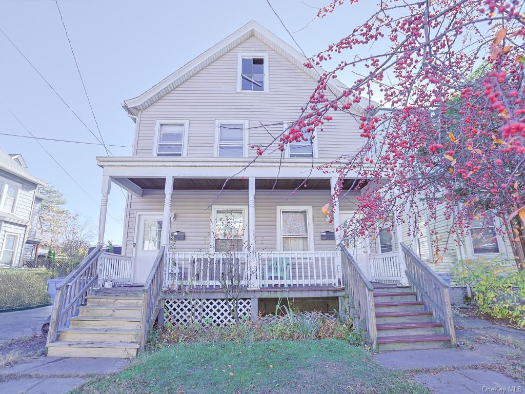 a front view of a house with stairs