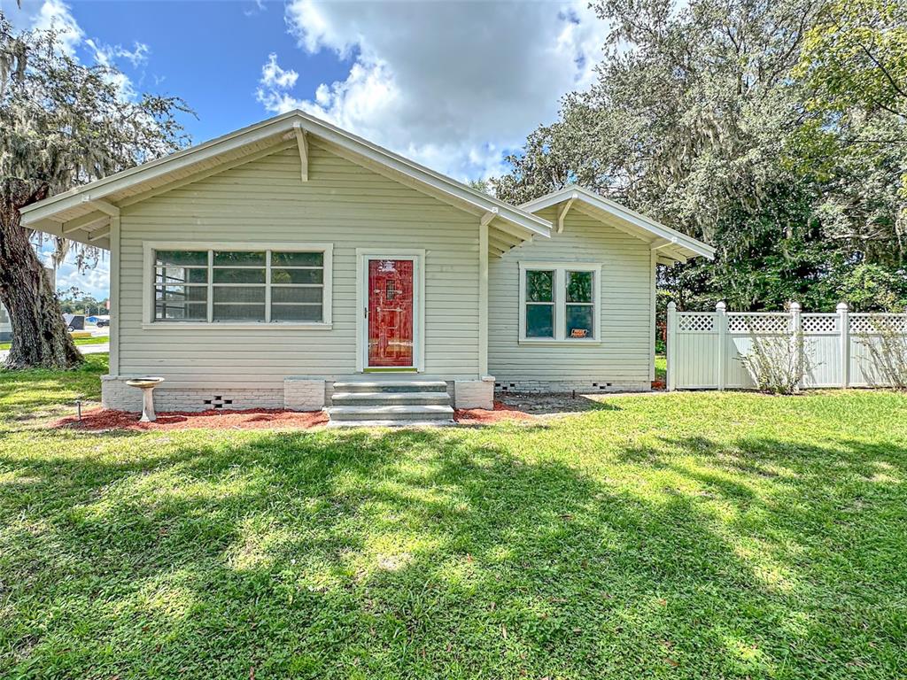 front view of a house with a yard