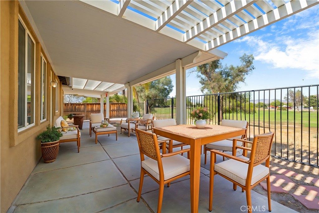 a view of a patio with a table and chairs