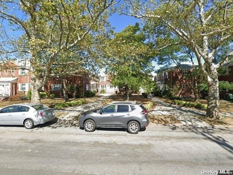 a view of a car parked in front of a house