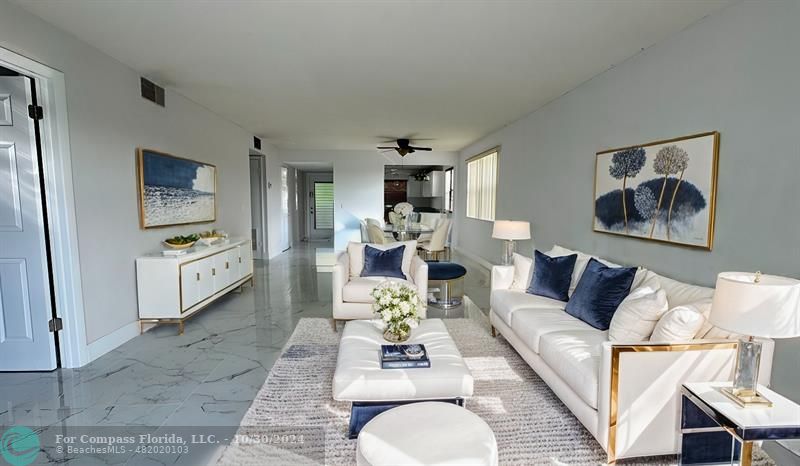 a living room with furniture and a rug