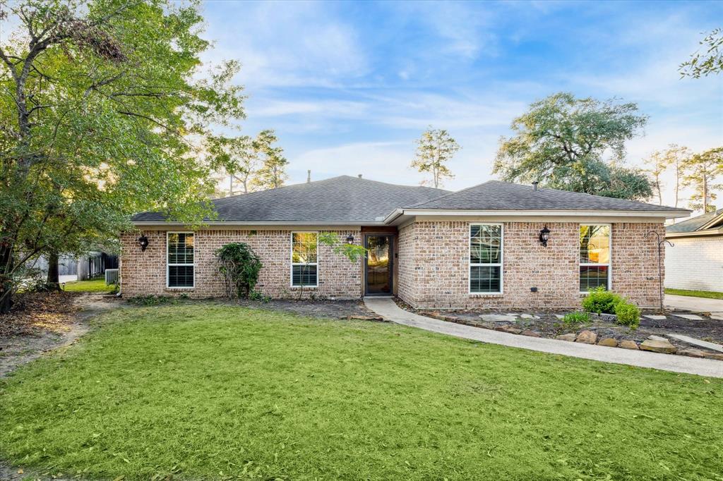 a front view of house with yard outdoor seating and green space