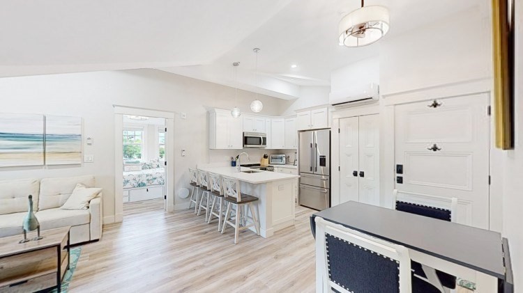 a large kitchen with a table and chairs