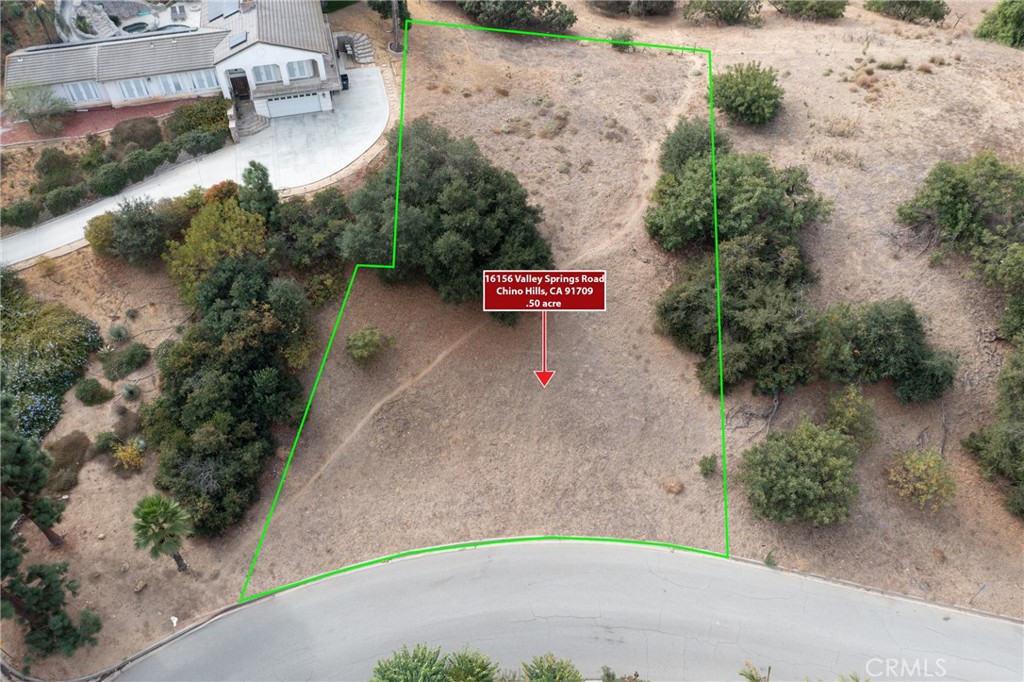 an aerial view of a houses with outdoor space