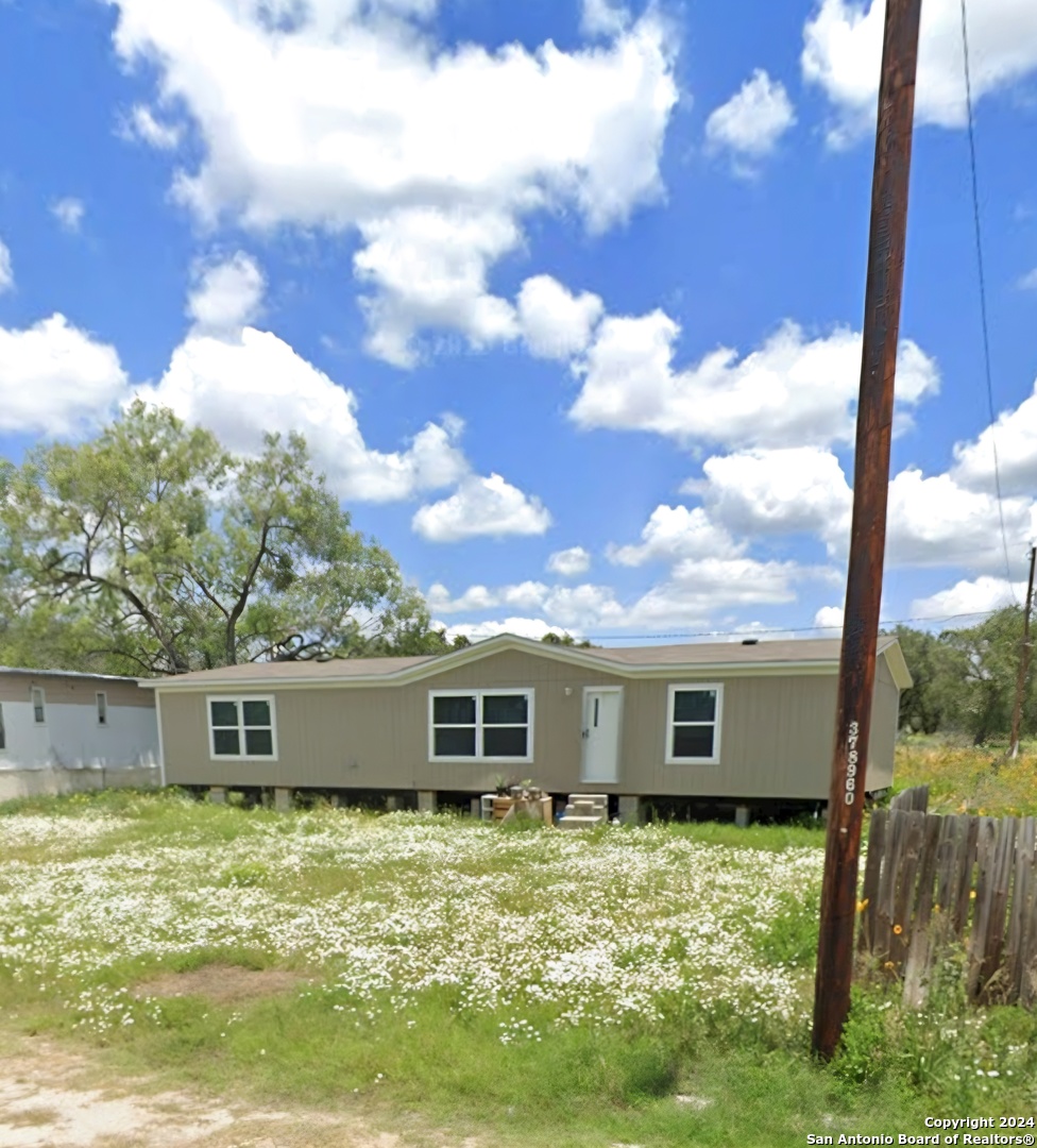 a view of a house with a big yard