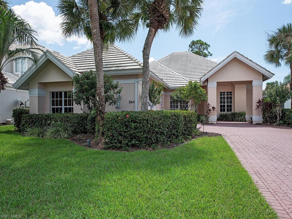 Ranch-style house featuring a front yard