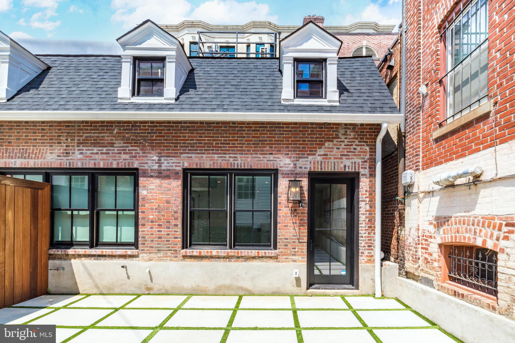 front view of a brick house with a window