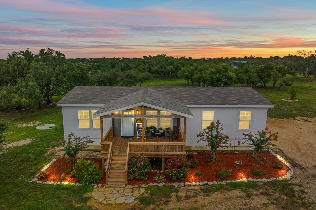 a aerial view of a house with a big yard