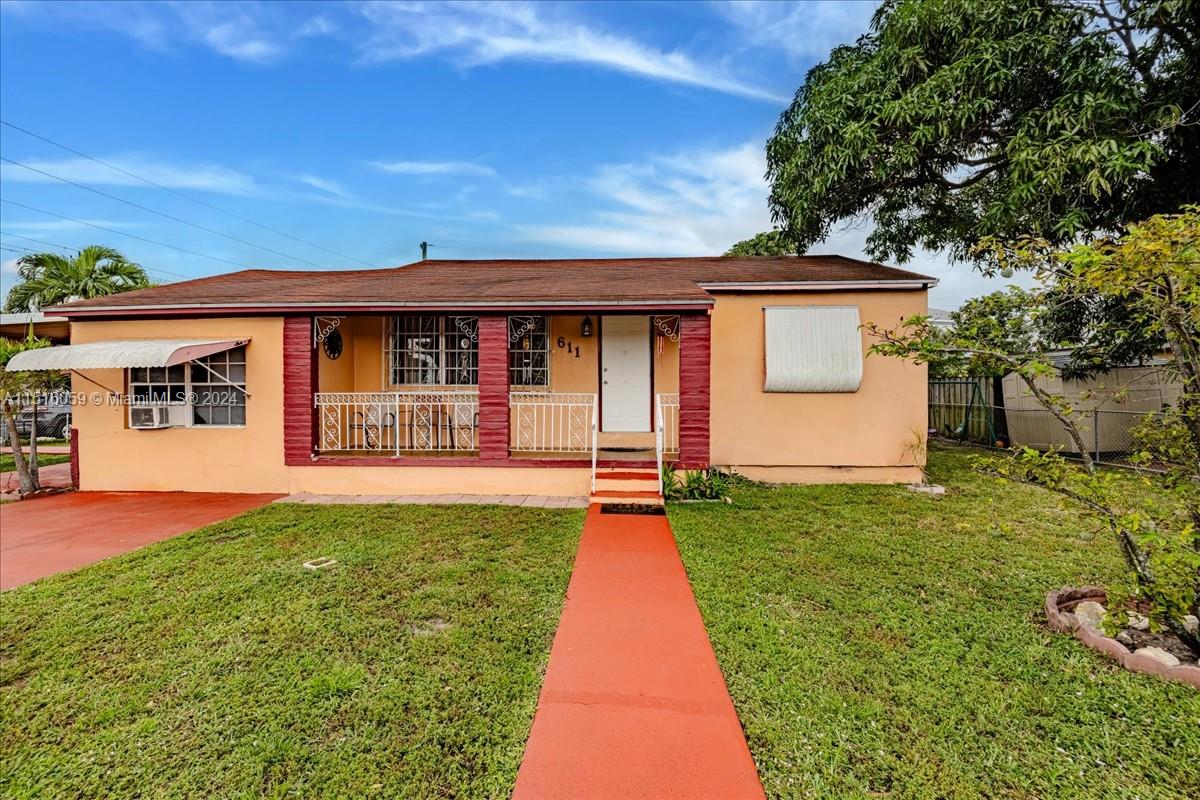 a front view of a house with yard