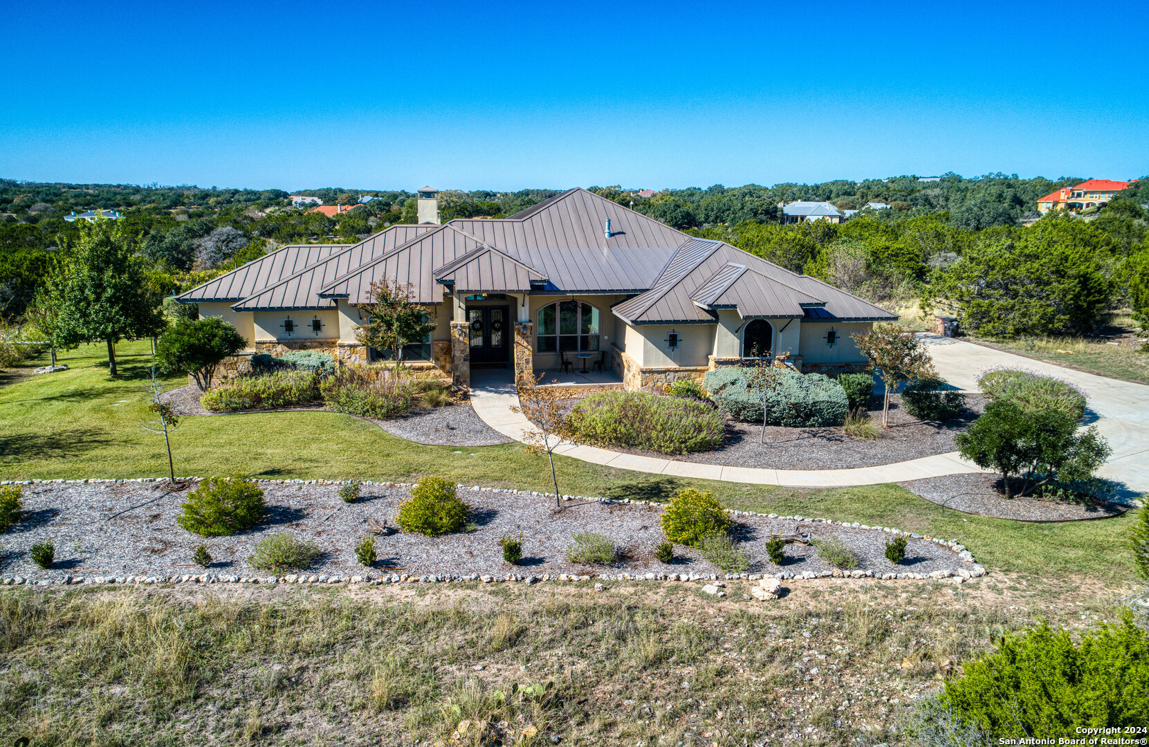 a front view of house with yard and green space