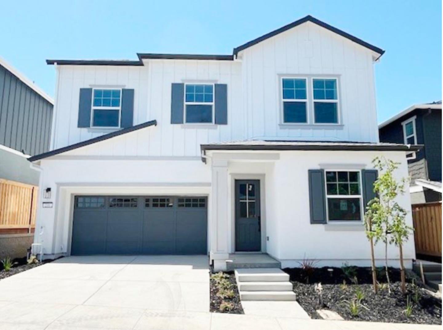 a front view of a house with a garage