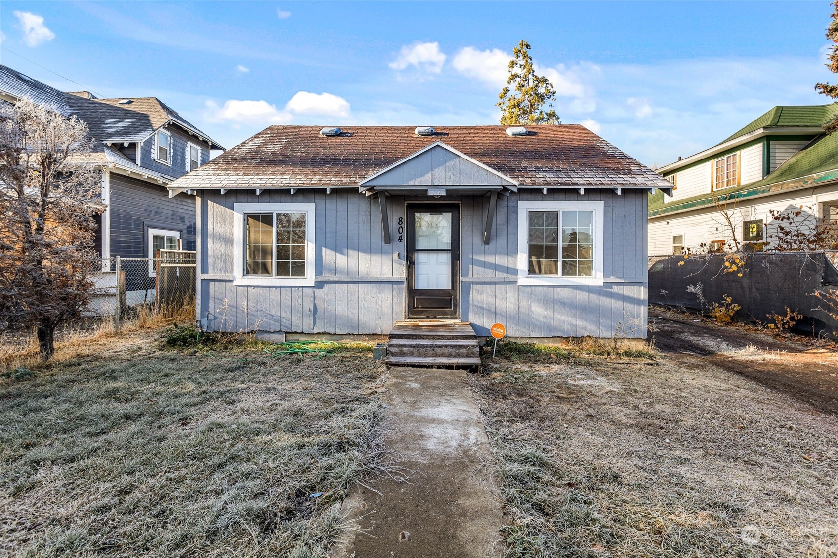 a front view of a house with a yard