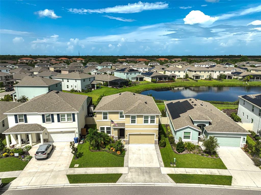 an aerial view of residential houses with outdoor space