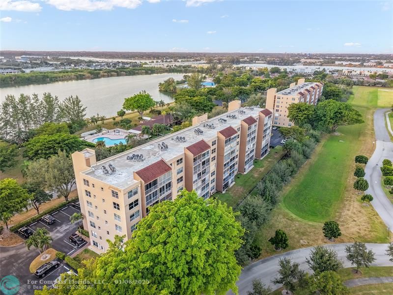 an aerial view of a city with lawn chairs