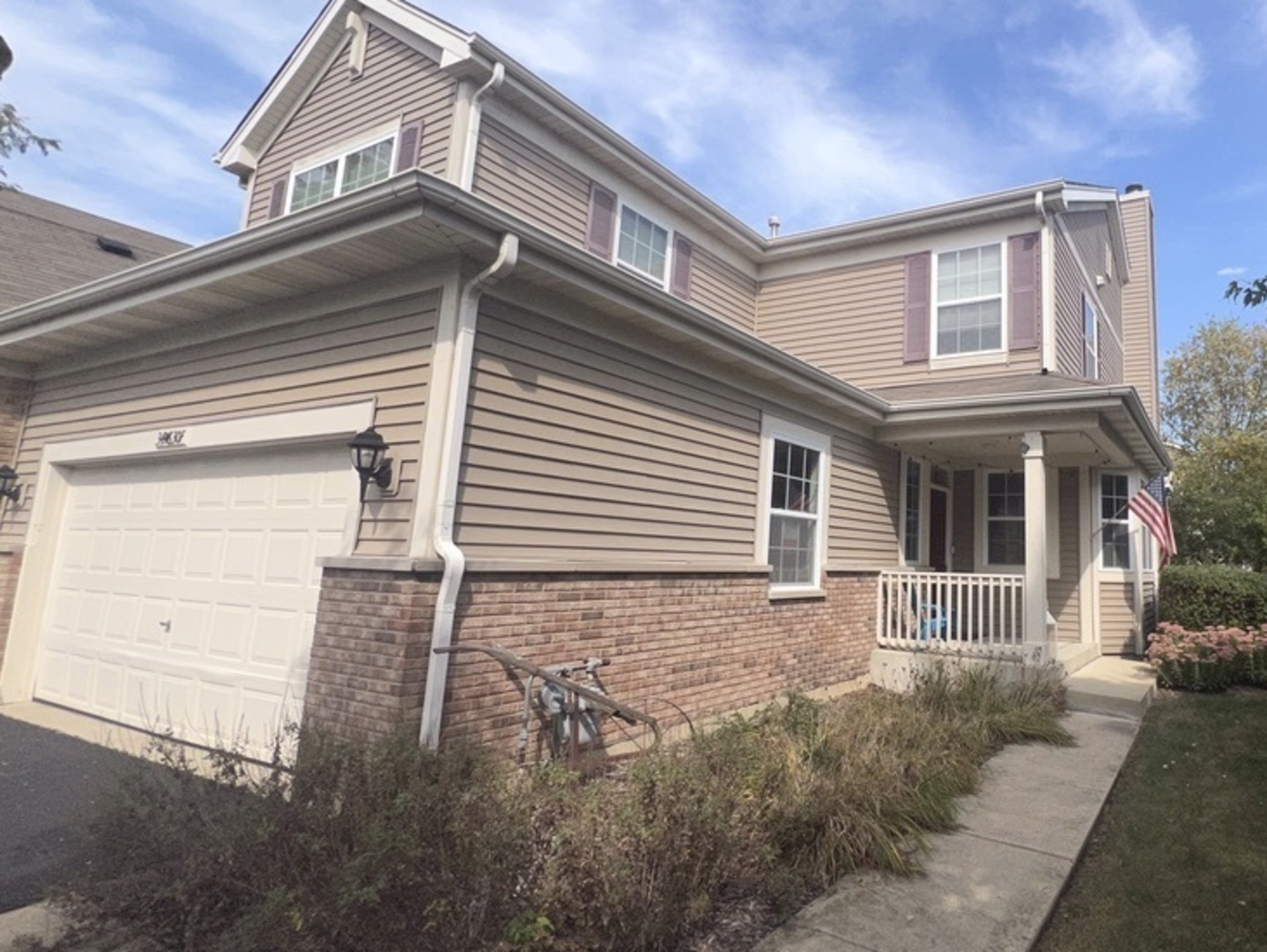 front view of a house with a small yard