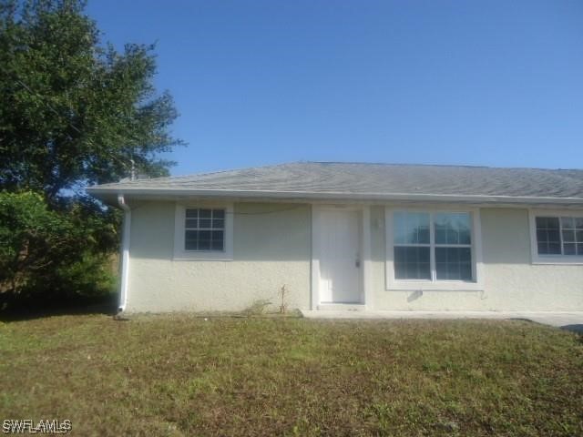 front view of a house with a yard