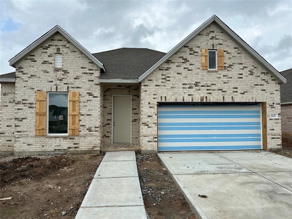 a front view of a house with a garage