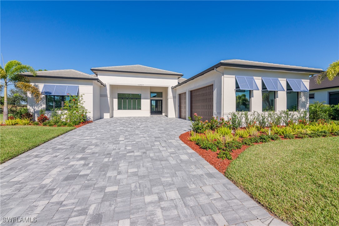 a front view of house with yard and green space