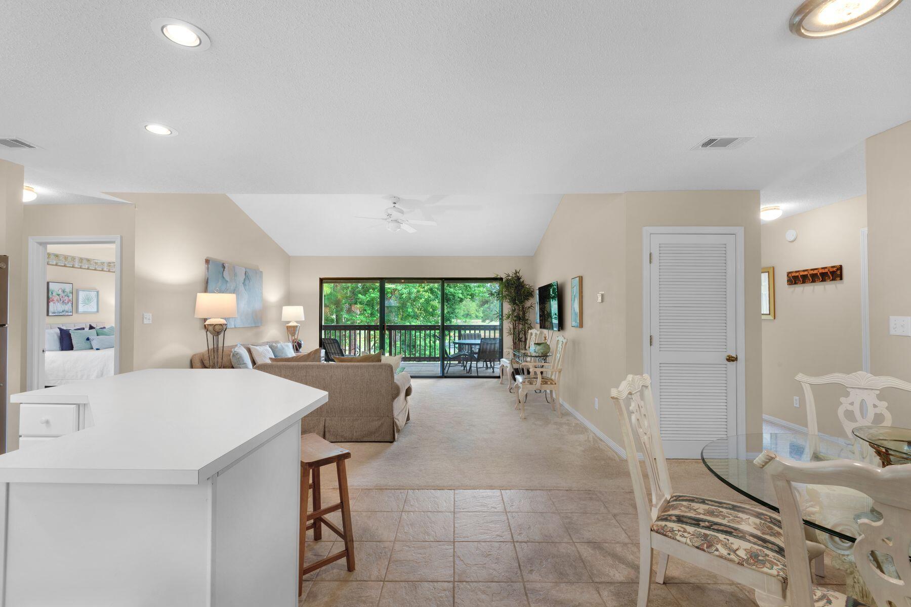 a large kitchen with a table and chairs in it