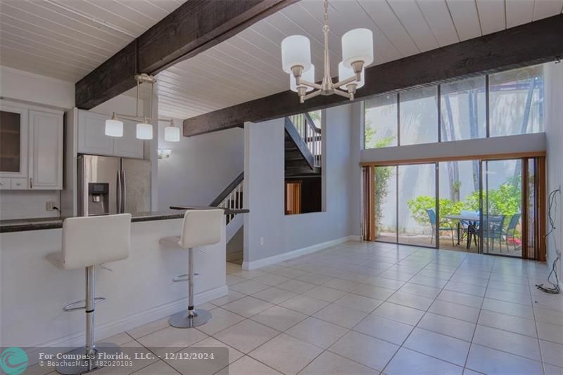 a view of entryway and kitchen