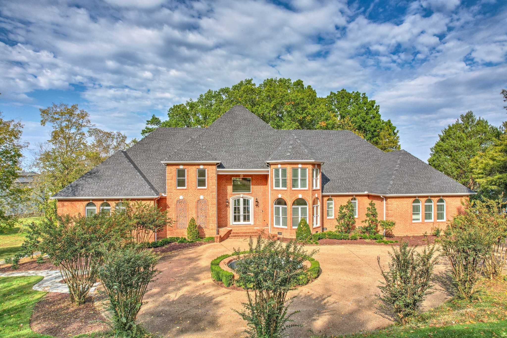 a front view of a house with a yard