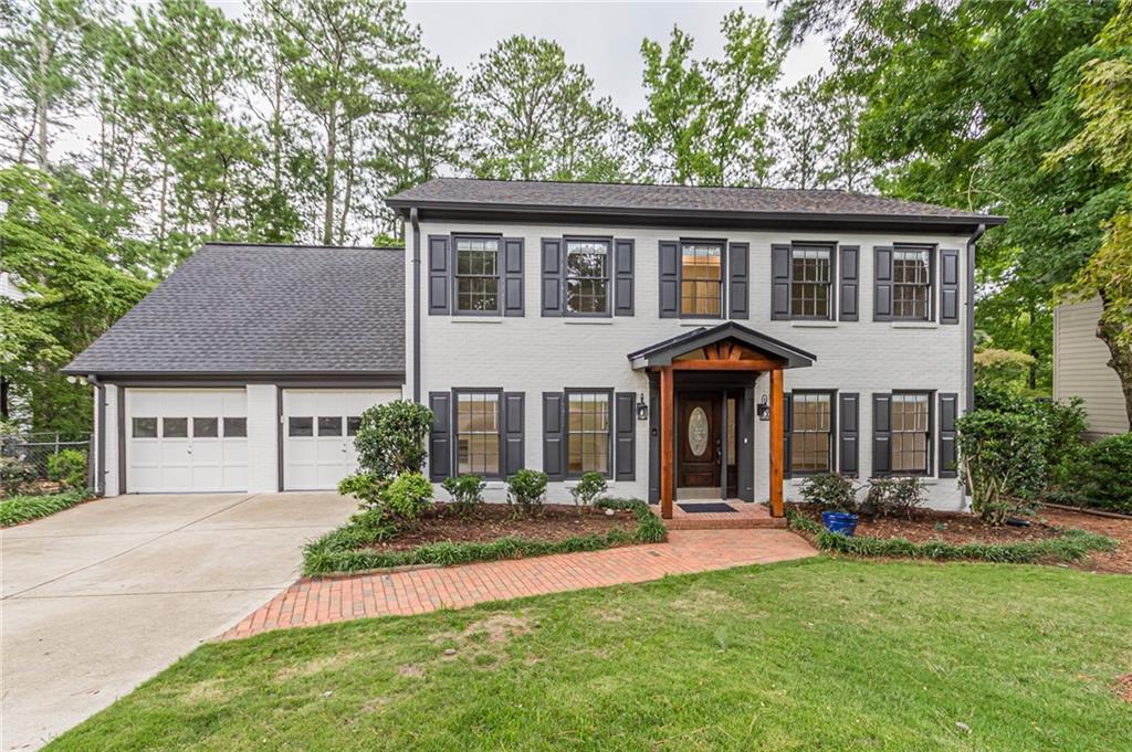 front view of a house with a yard