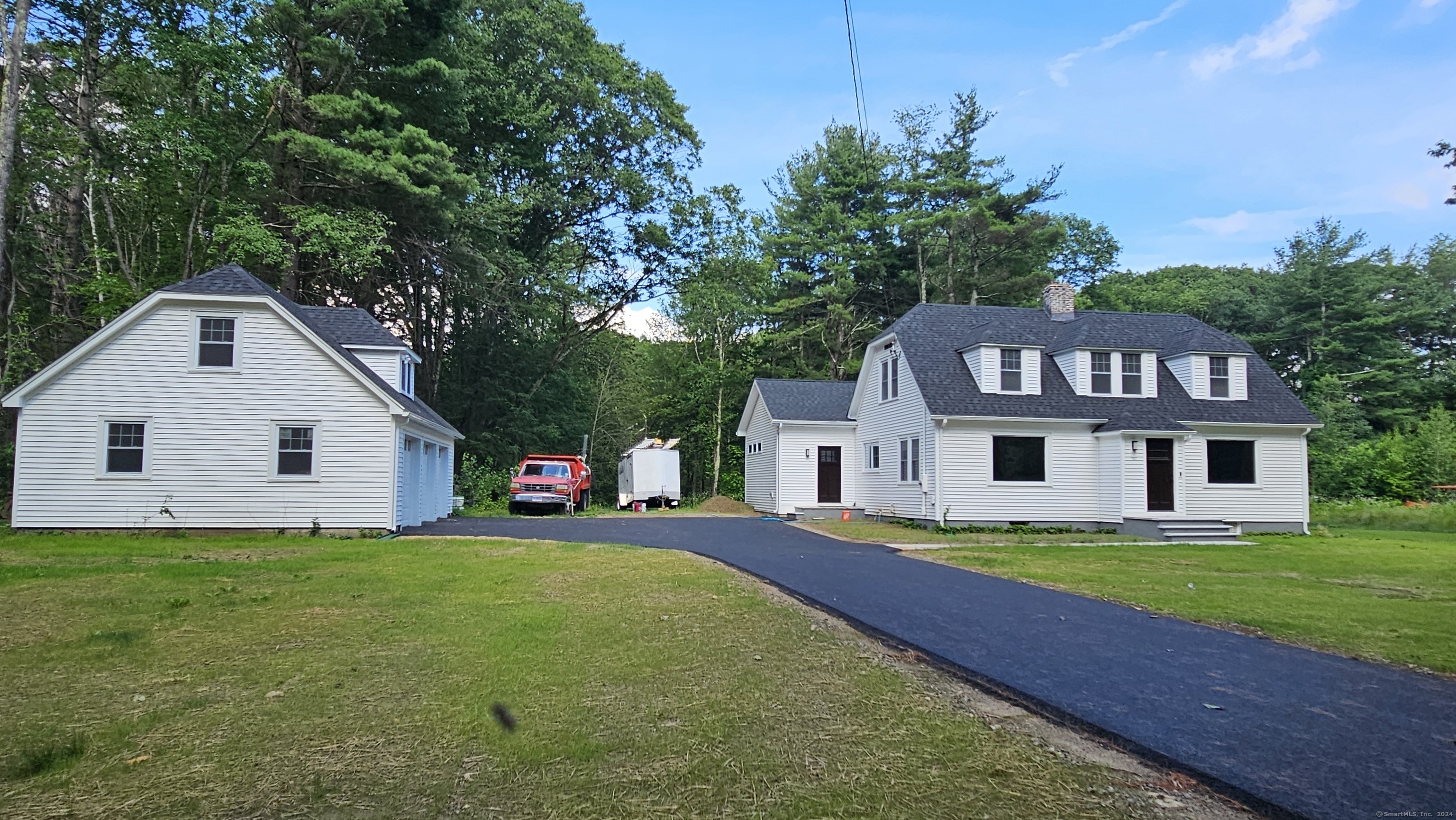 a view of a house with a yard