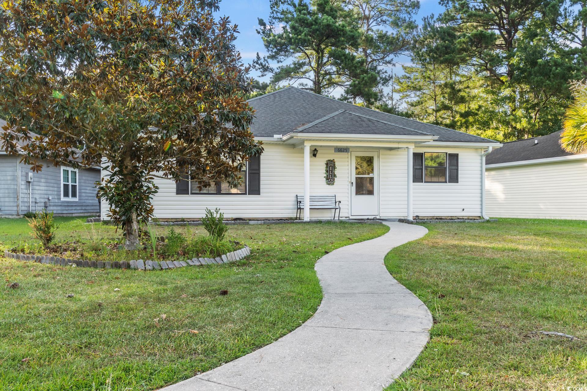 Single story home featuring a front yard