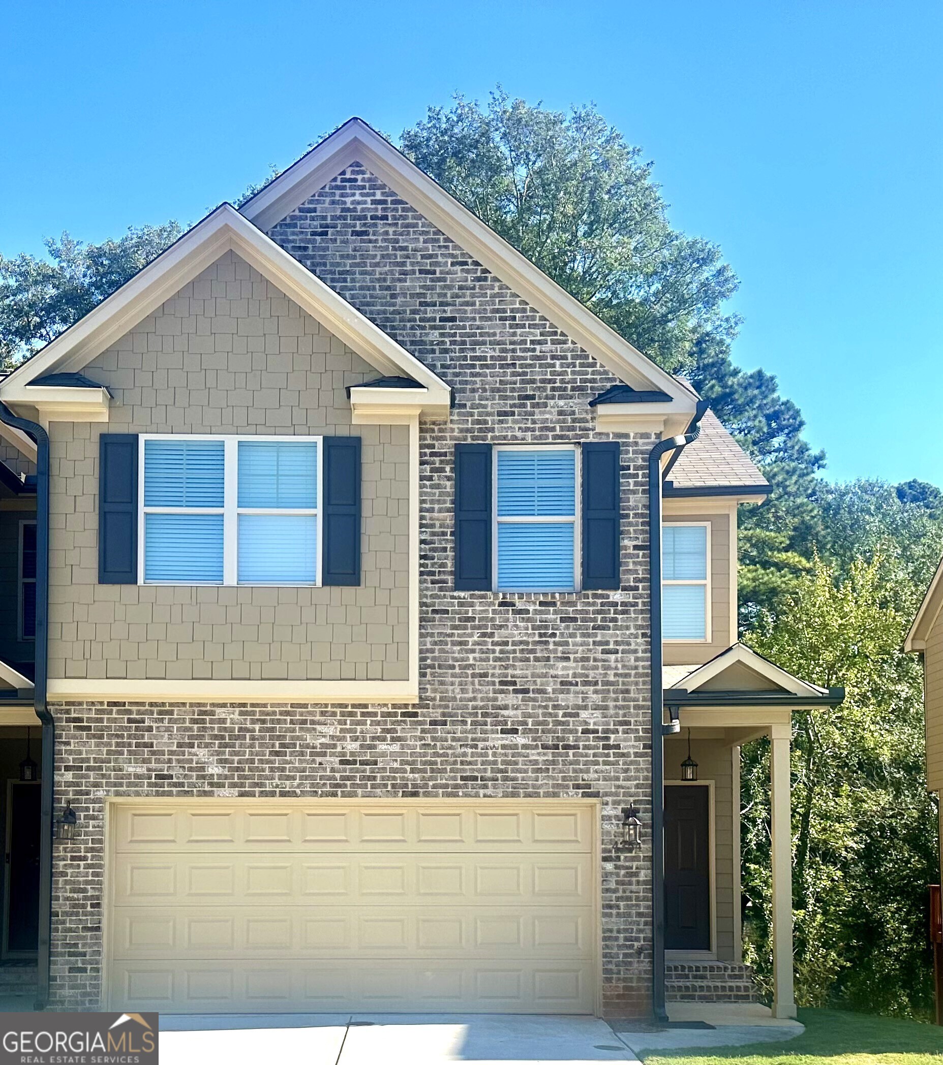 a front view of a house with yard