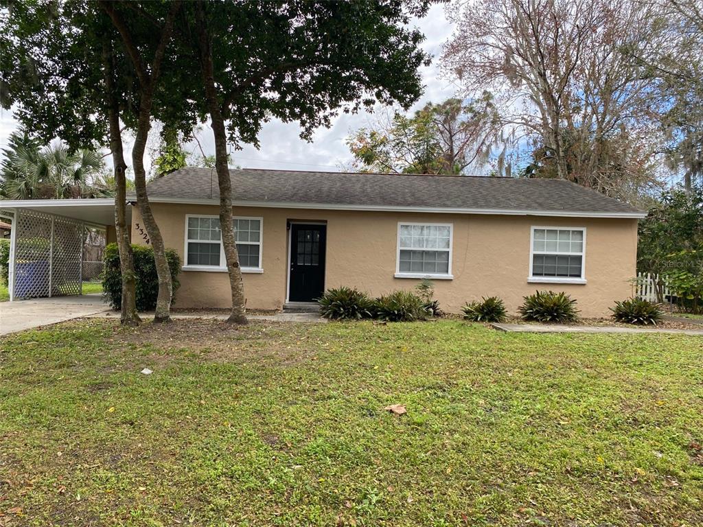 front view of a house with a big yard