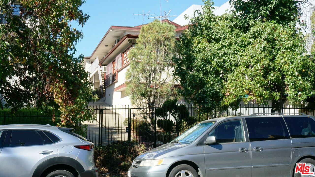 a view of street and car parked