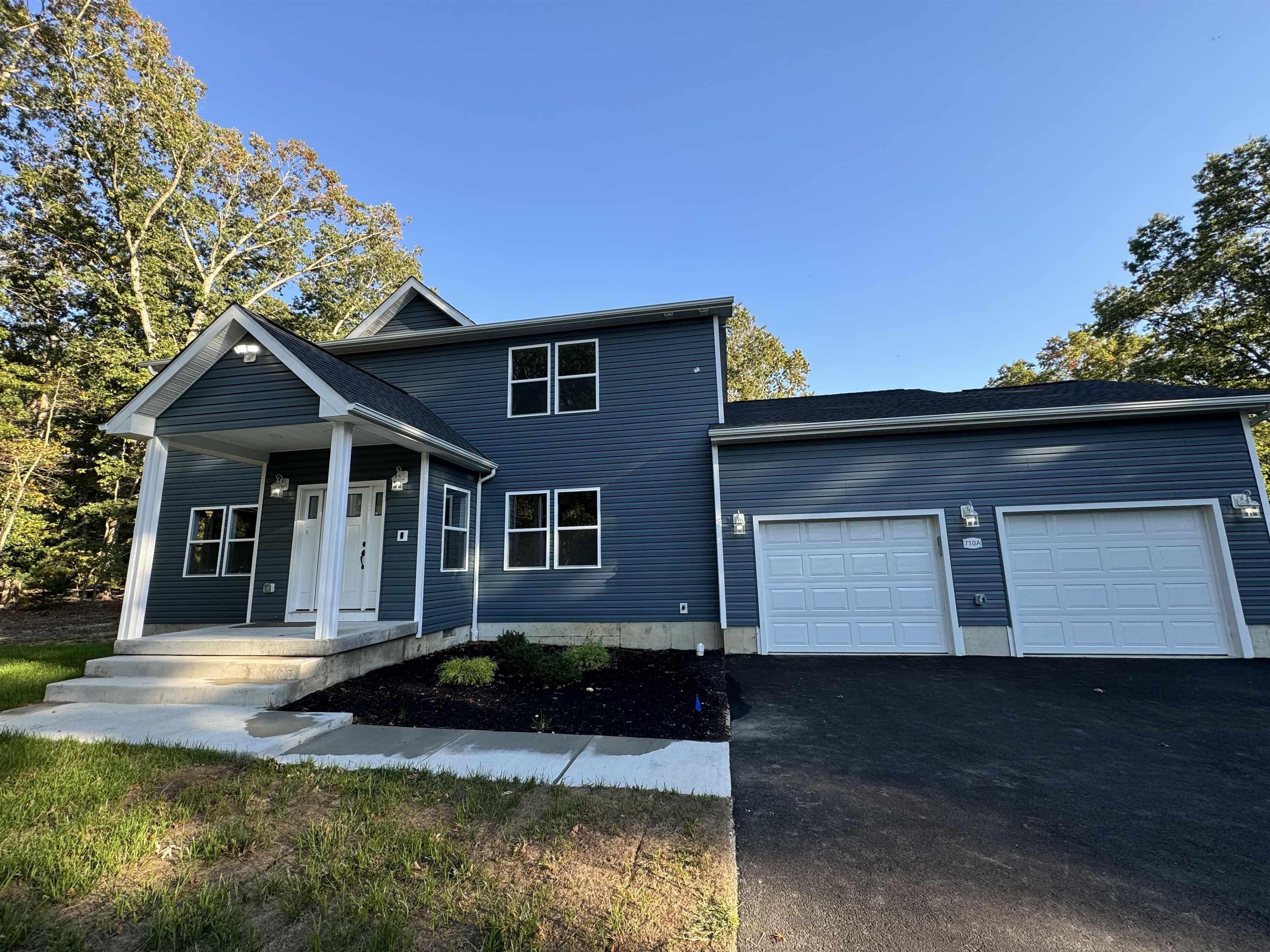 a front view of a house with yard