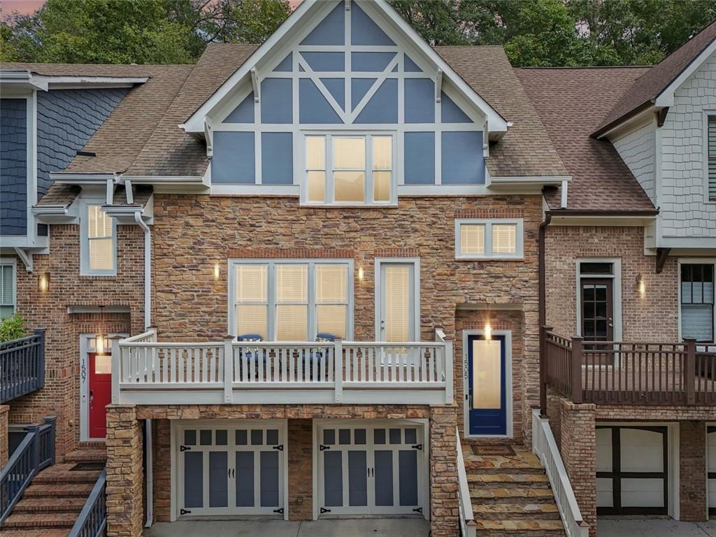 a view of a house with a deck front of house