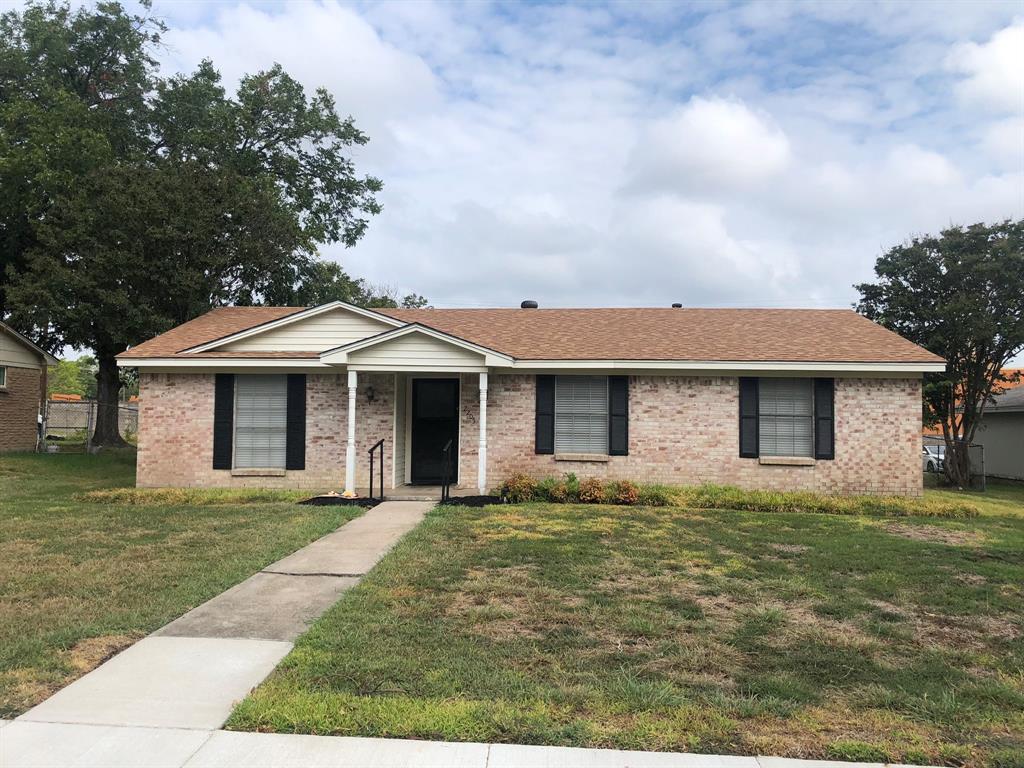 a front view of a house with yard