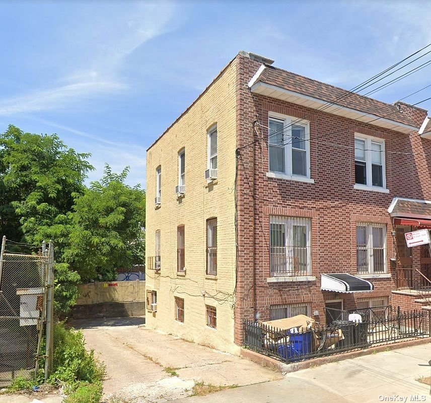 a front view of a building with street view