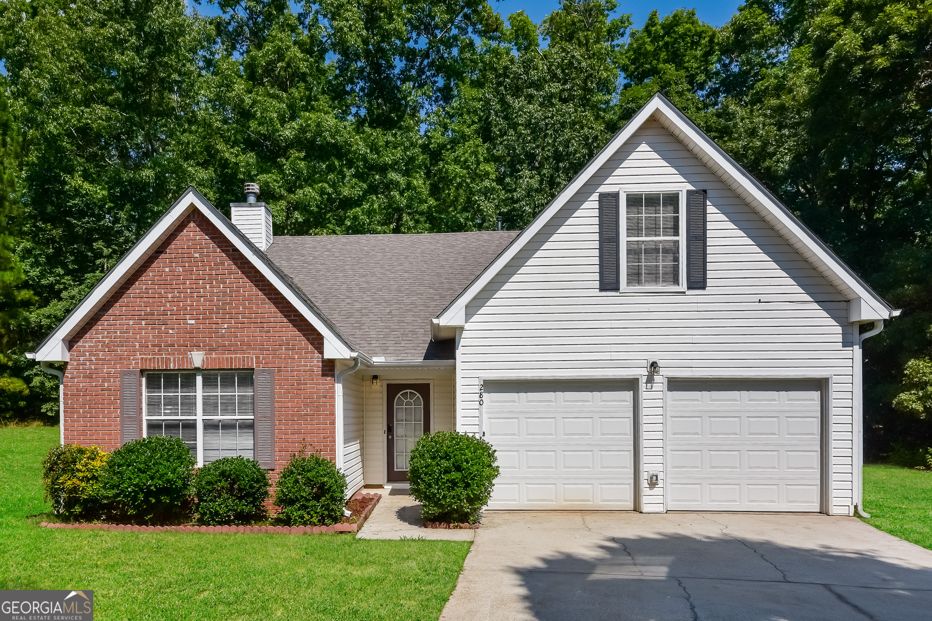 a view of front of house with a yard