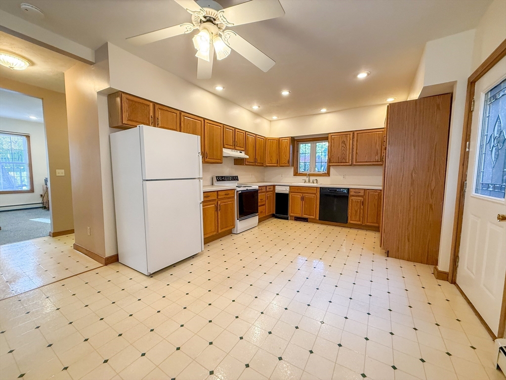 a kitchen with a refrigerator a sink and dishwasher