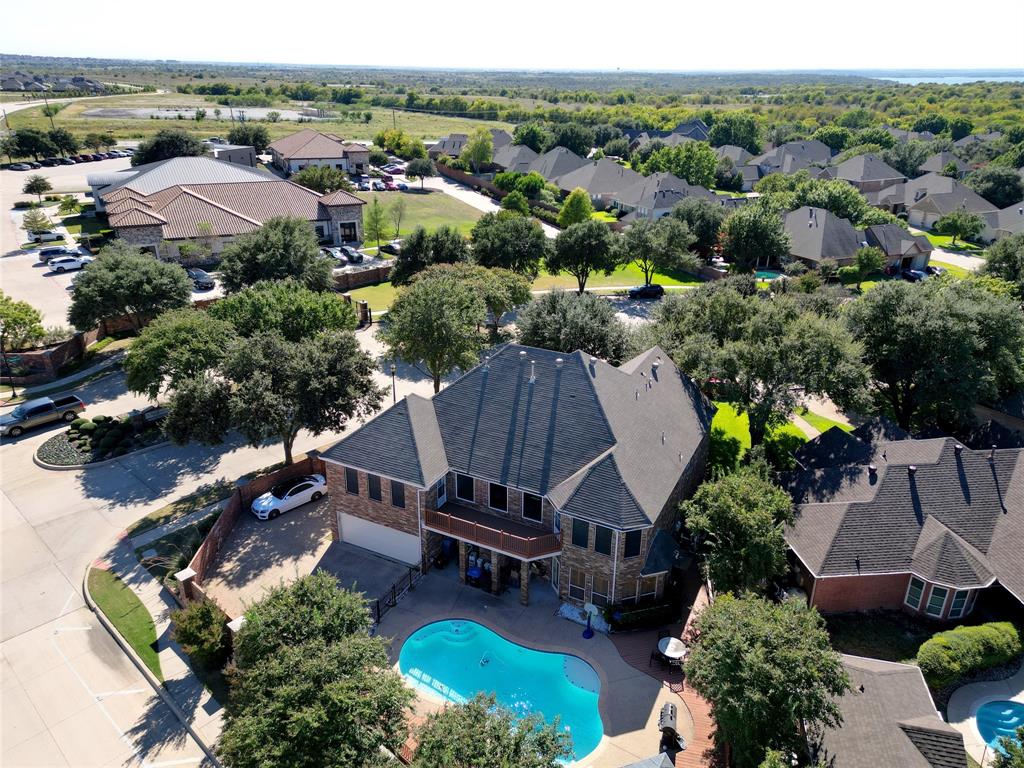 an aerial view of a house with garden space and street view