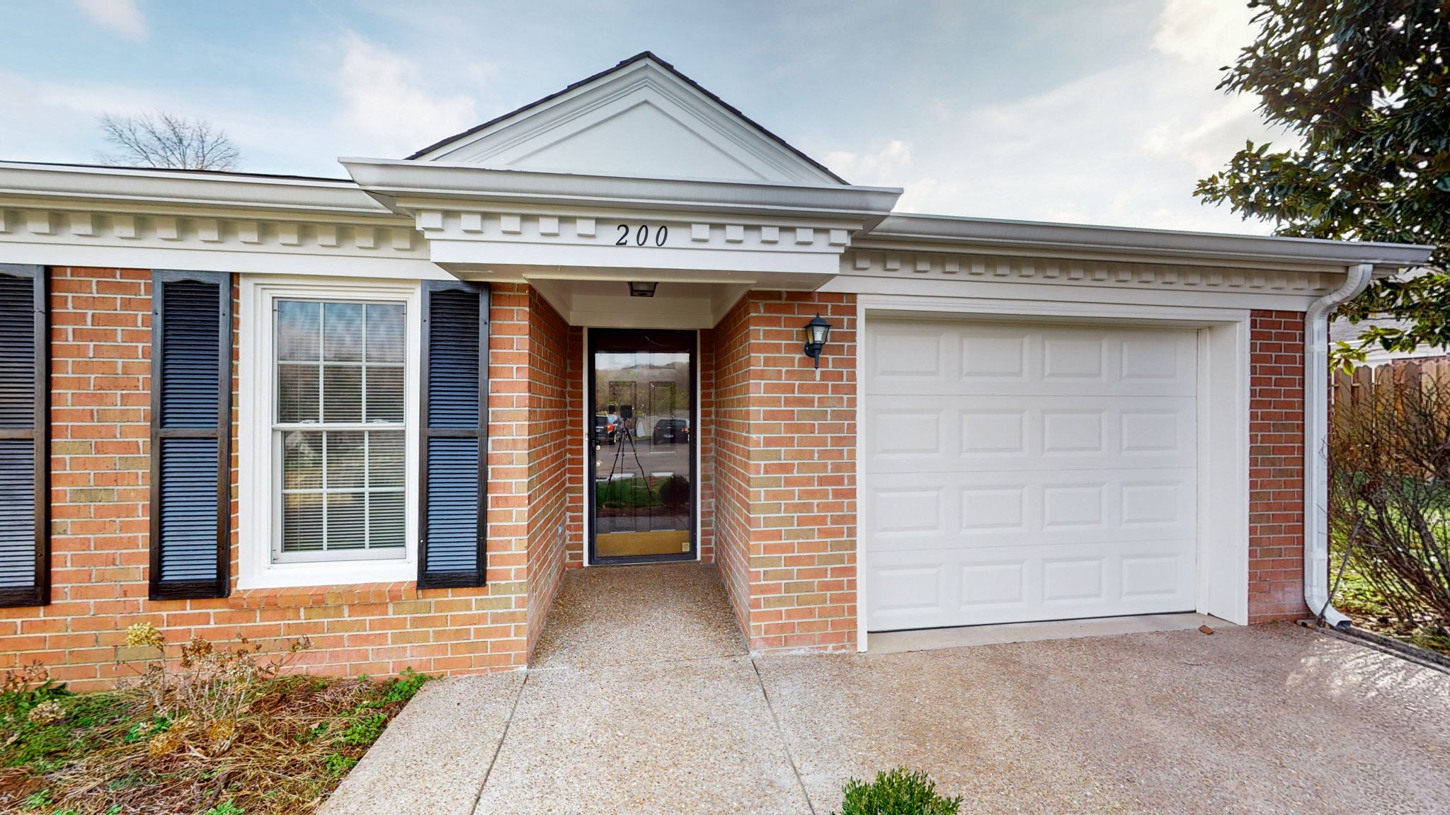 Covered front entryway. Glass storm door adds a lot of light.